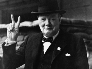 FILE - This is a Aug. 27, 1941  file photo of British Prime Minister Winston Churchill as he gives his famous " V for Victory Salute" . Churchill Britain's famous World War II prime minister died fifty years ago on January 24 1965. (AP Photo, File)